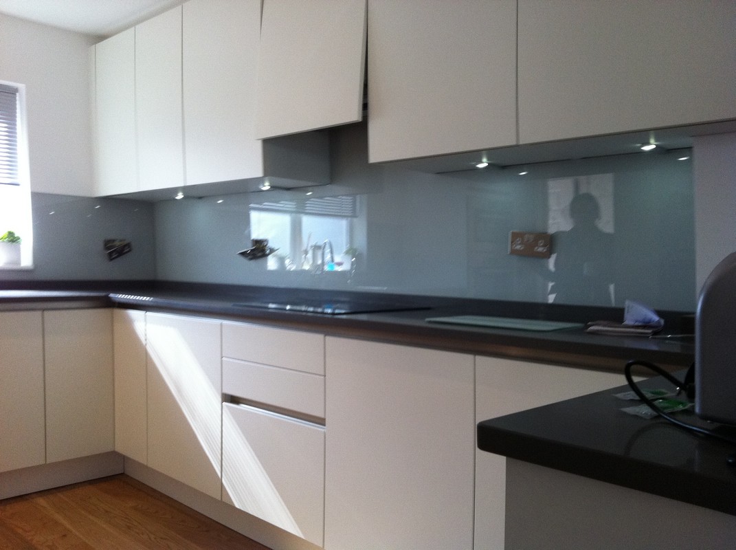 Grey glass kitchen splashback with LED lighting in Southall