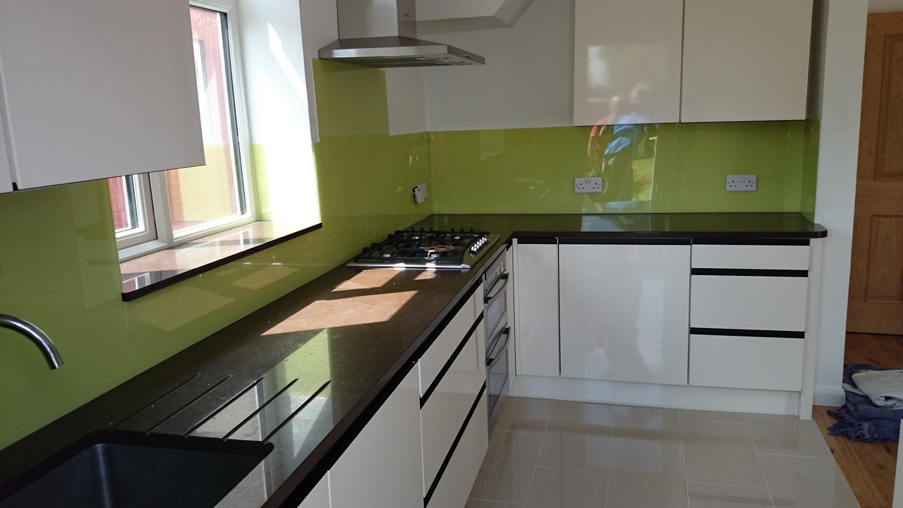Lime green glass kitchen splashback installed by Southall glaziers