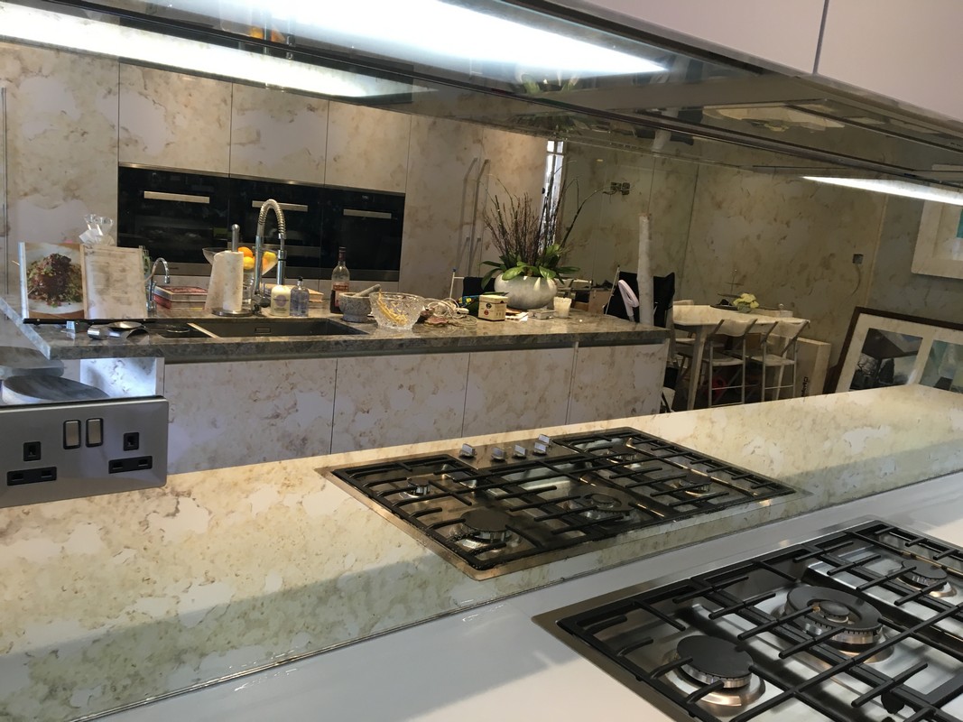 Mirror glass splashback in Southall luxury kitchen